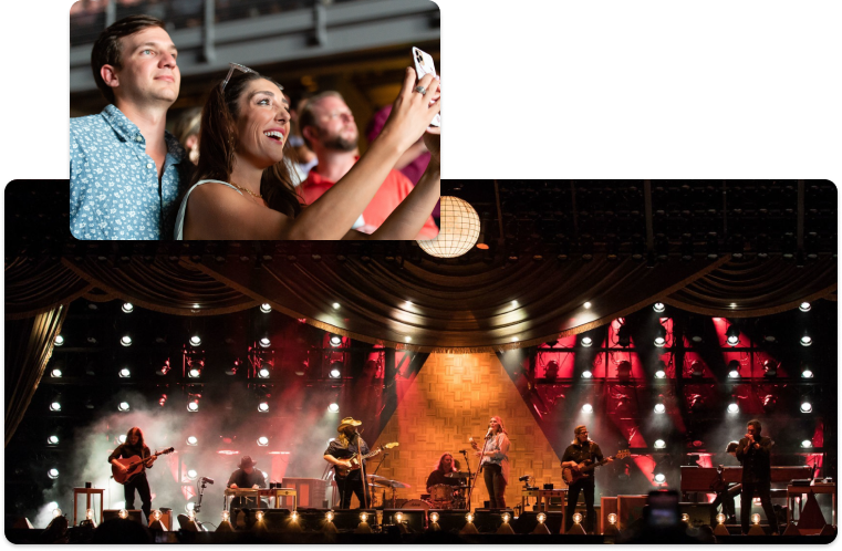 Country band on stage and fans taking a photo
